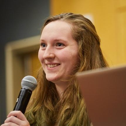 A student asks a question during a Center for Global Humanities lecture