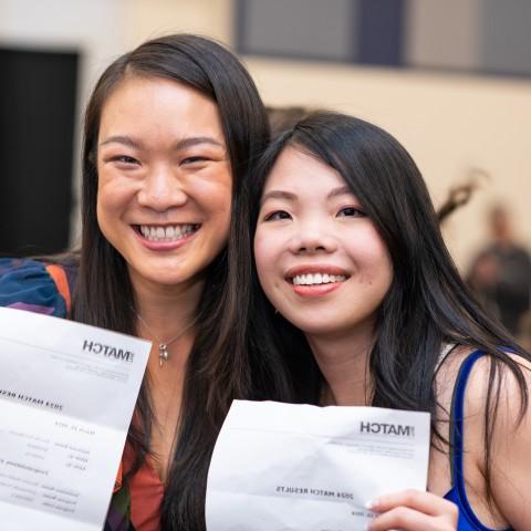 Two female students celebrate their residency matches